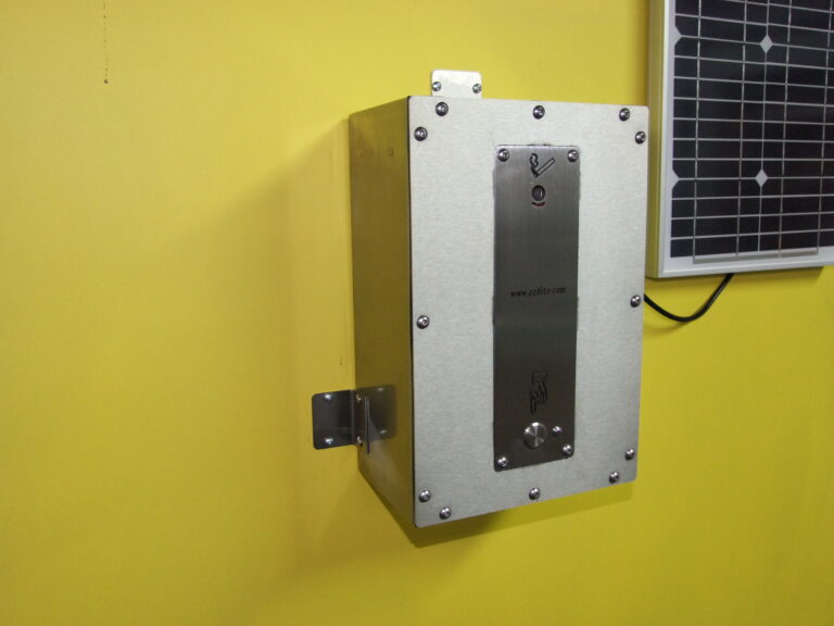 Angled view of Ozilite ACLBAT enclosure and wall-mounting brackets