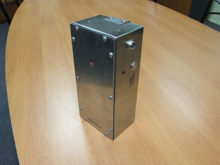 Three-quarter view of the compact Ozilite ACLBPS stainless-steel enclosure