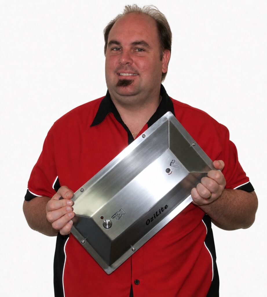 Adam holding an Ozilite ACL WMT wall-mounted flameless cigarette lighter